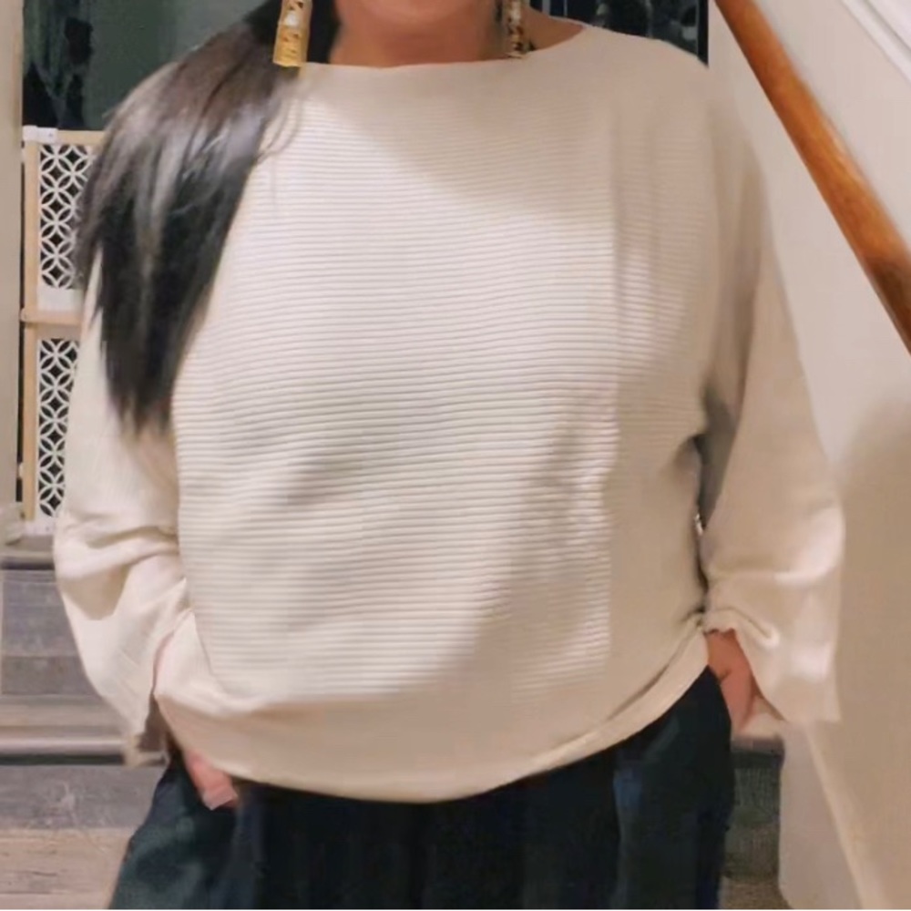 Lightweight sweater lower in back